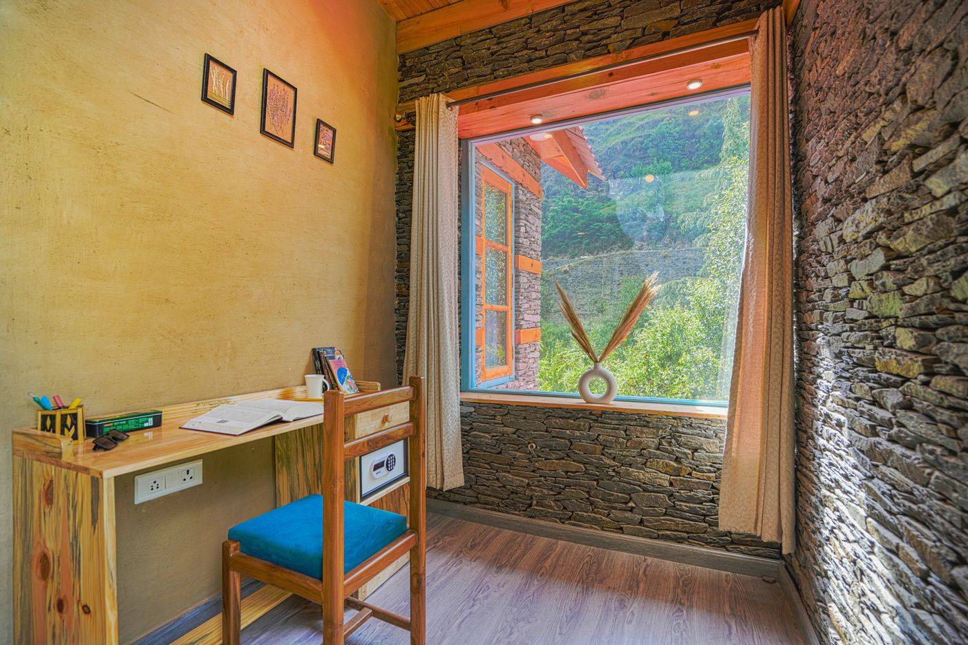 Desk by a window framing the mountains