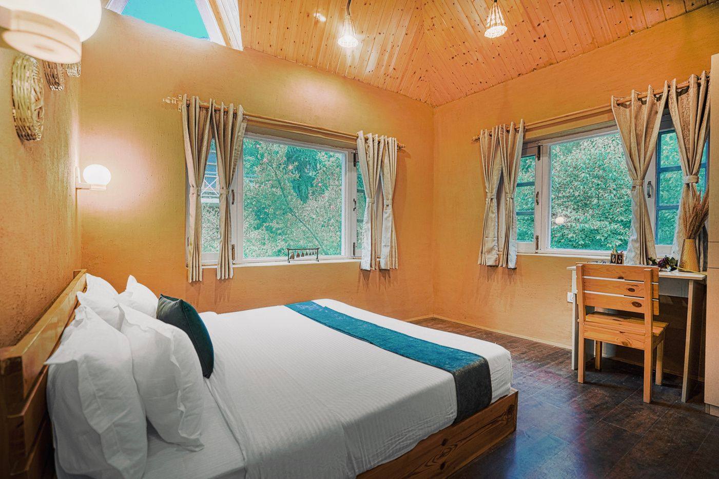 Room 201 double bed with mountain windows