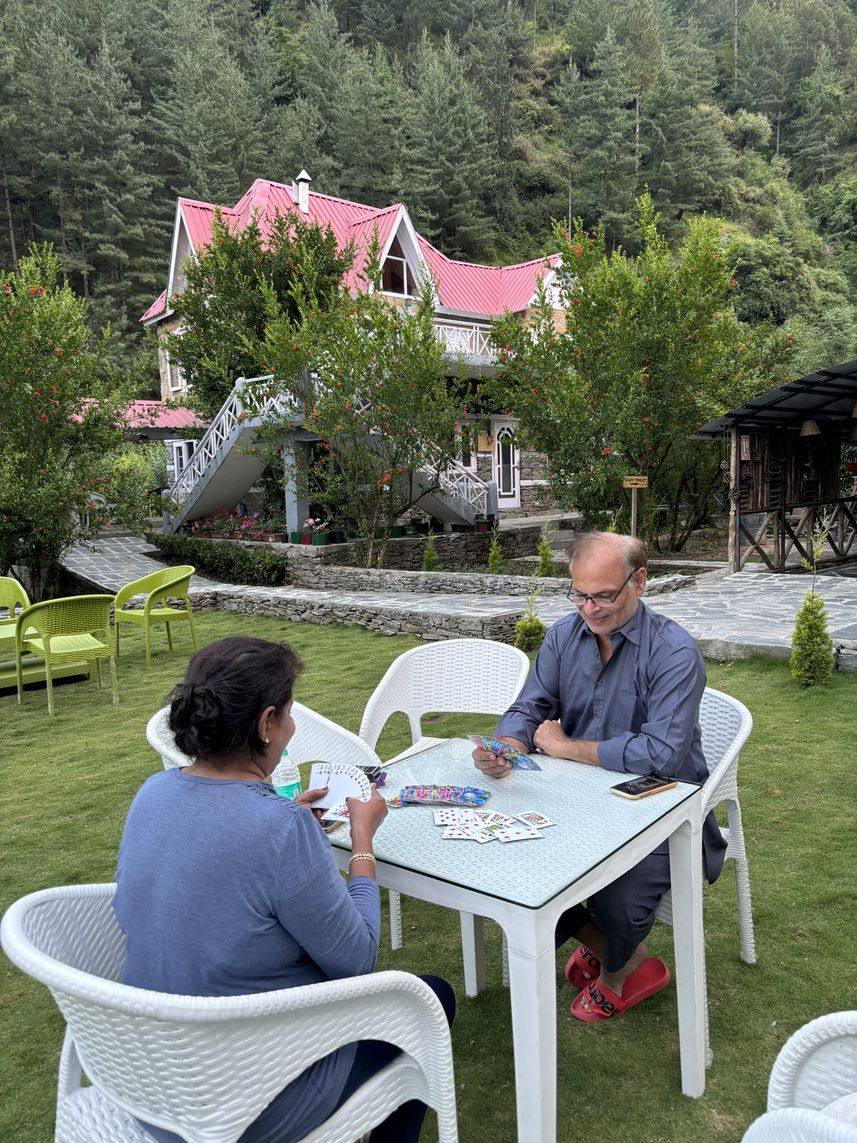 Guests playing cards on the lawn