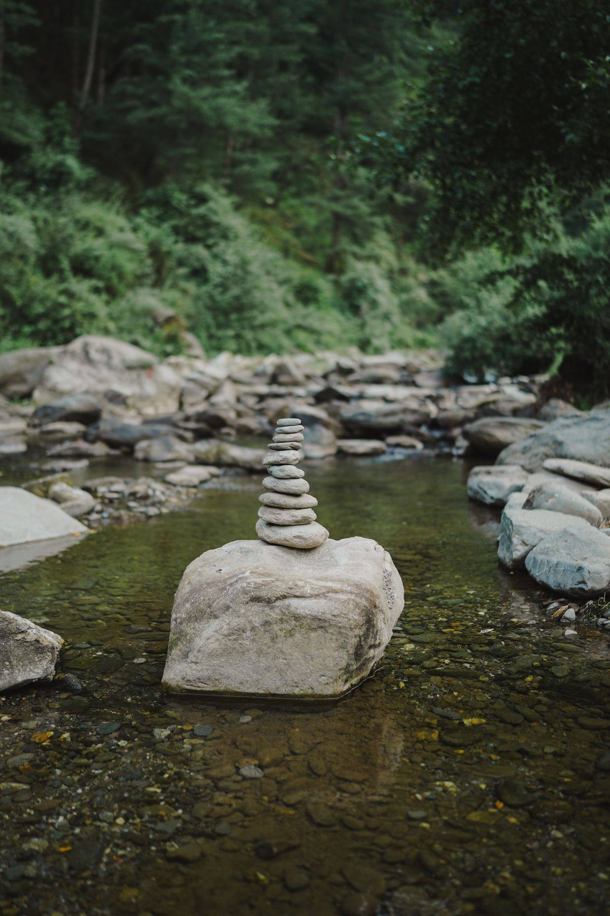 Balanced stones in the clear private river